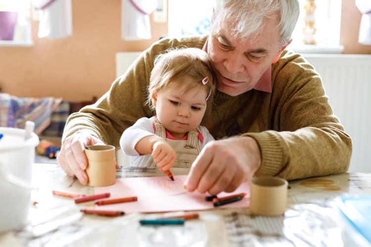 Grandfather Playing With Grandchild During Canadian Thanksgiving