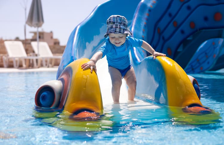 young child on waterslide at one of the best all-inclusive family resorts in the us