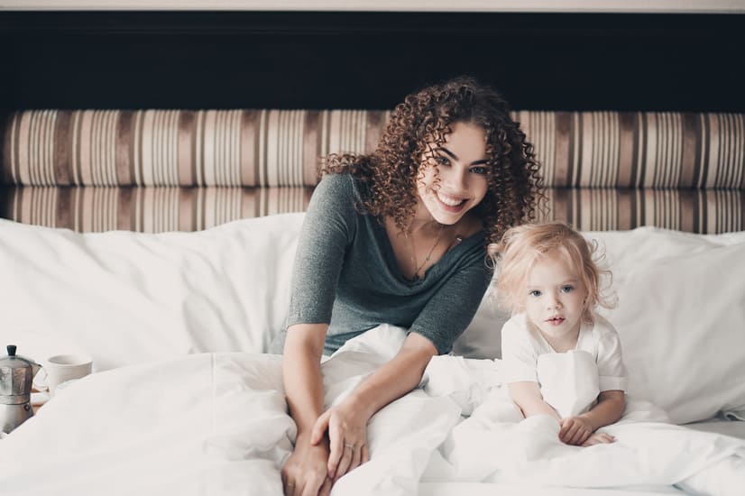 mom and little girl on family vacation taking some down time