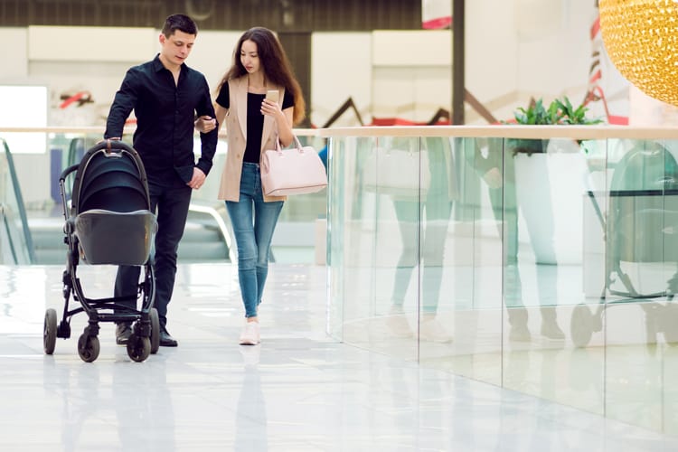 {Updated} 14 Tips For Stress-Free Flying With Babies And Toddlers 8 Parents With Baby In Airport For A Stress-Free Flying Experience