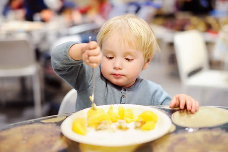 Santa Fe: Unique Places to Eat, Play & Sleep for Families 2 child eating at restaurant in santa fe