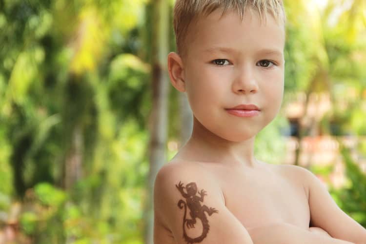 little boy with henna tattoo