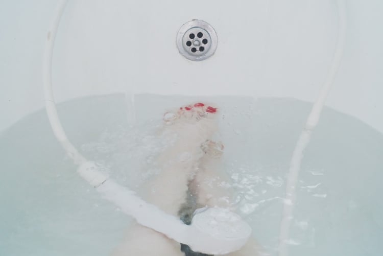 mom taking a bath for self-care