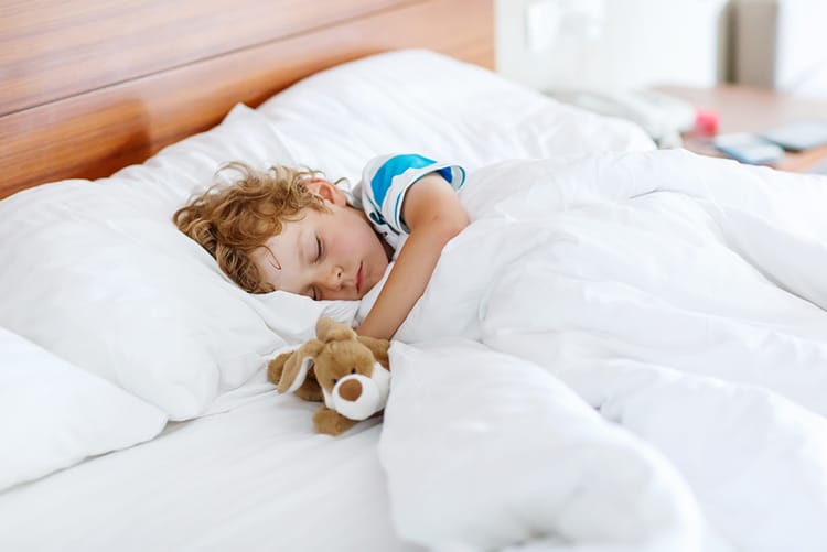 Baby Sleep Problems: Top Things That Disturb Baby’s Sleep 6 child resting peacefully after overcoming baby sleep problems
