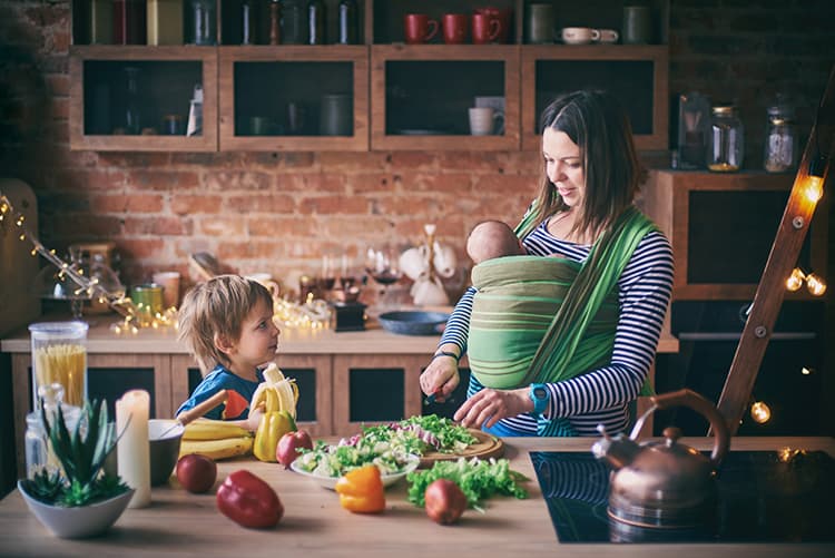 How to Increase & Maintain Breast Milk Supply: Tips from a Holistic Certified Nutritionist 6 mother preparing healthy food for herself and her toddler