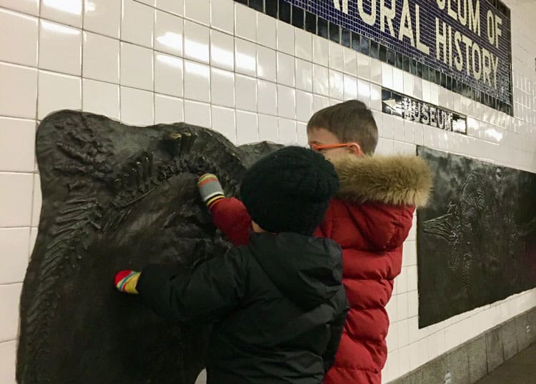 Visiting The American Museum Of Natural History With Kids 6 Children Touching A Fossil