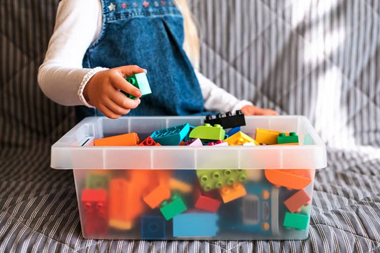 Working From Home With Kids: 14 Tips &Amp; Tricks For Success 11 Girl Playing With Bin Of Building Blocks