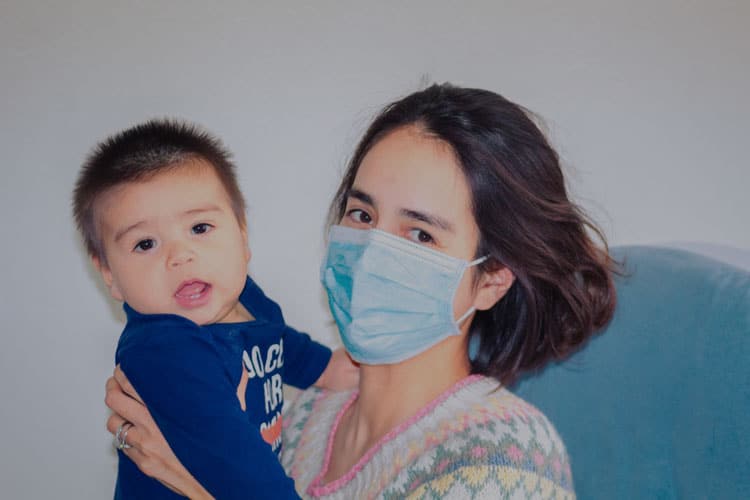 20 Coronavirus Travel Tips to Keep Your Family Safe 6 mother wearing mask with son