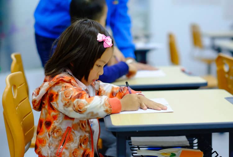 How to Help Your Child With Back-to-School Anxiety 7 asian girl doing school work