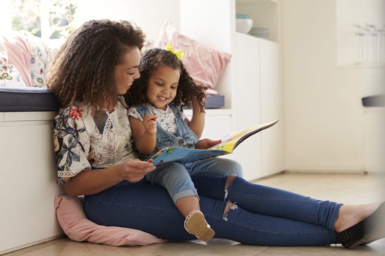 mother reading to her daughter