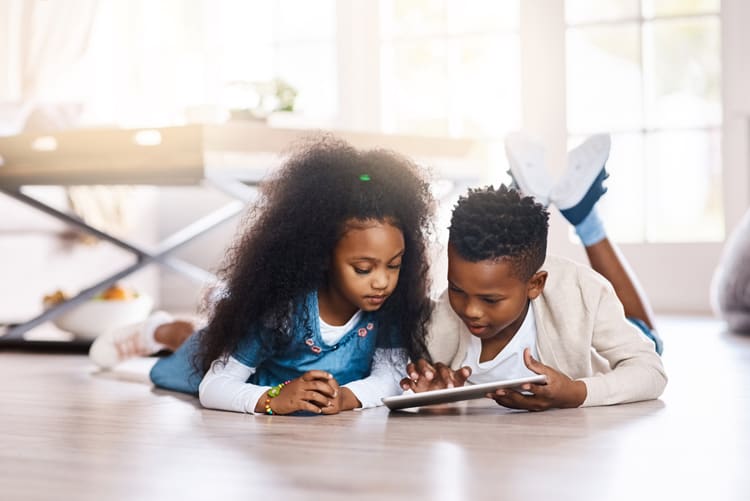 10 Tips for Keeping a Clean House With Kids 8 children using screentime on a mobile device
