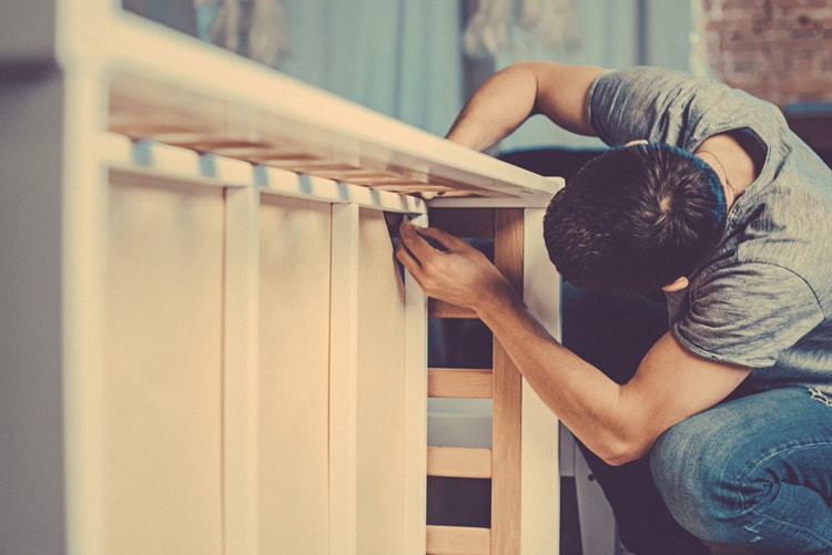 Best Cleaning Services For Busy Parents 4 Man Assembling A Crib