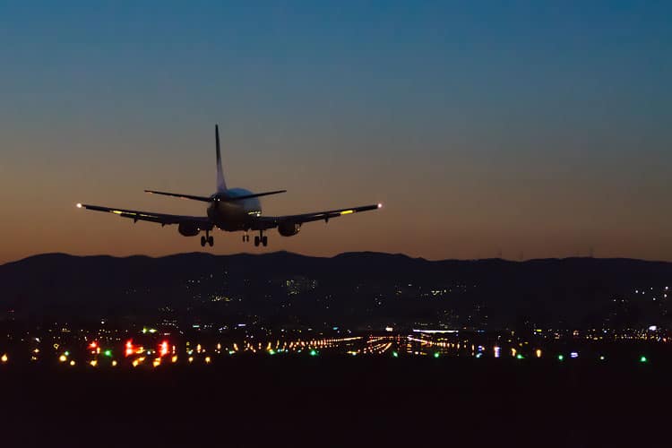 Flying With a Newborn: 10 Ways to Make it Easier 3 airplane at night