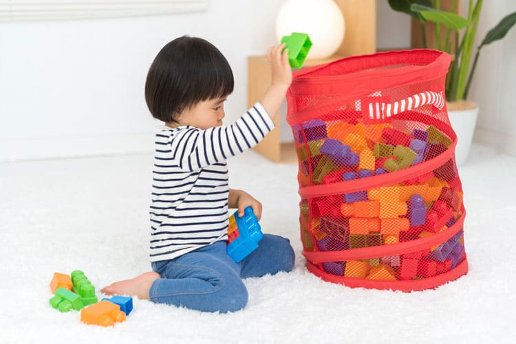 25 Daily Cleaning Routine Ideas For Kids 2 Child Picking Up Toys