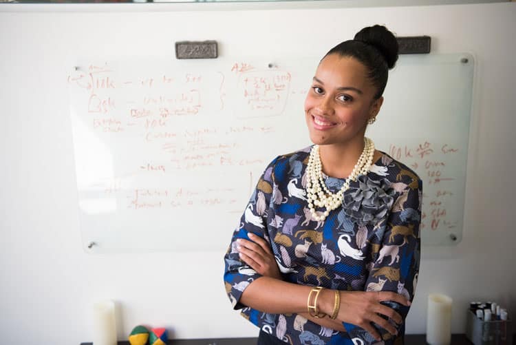 teacher standing in front of a board