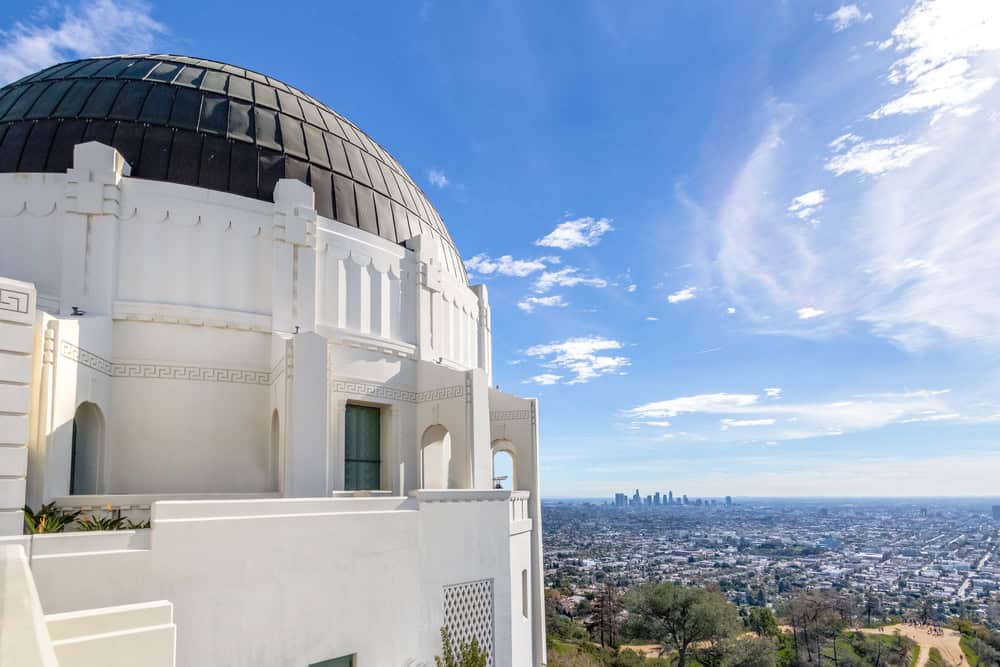 Iconic Griffith Observatory in Los Angeles with city skyline view.