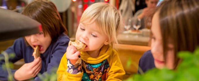 Child Enjoying Food At Sesame Place, Highlighting Allergy-Friendly Dining Options For Kids.
