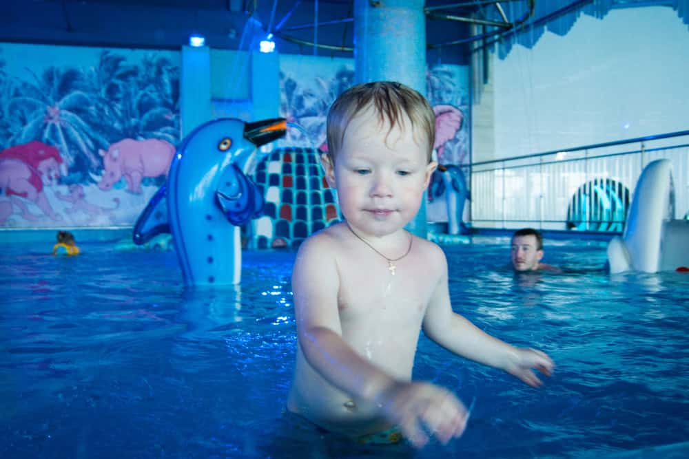 Child enjoying water play at Wisconsin Dells waterpark with fun aquatic features.