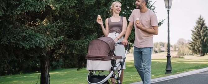 Comfortable Parents Walking With Baby Stroller In Park, Outdoor Family Activity, Baby Gear Rental, P.