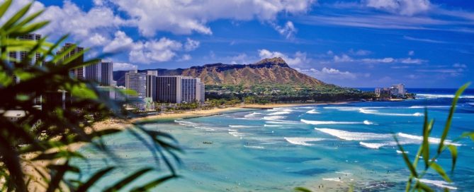 Relaxing Waikiki Beach With Calm Waters And Scenic City Views In Hawaii.