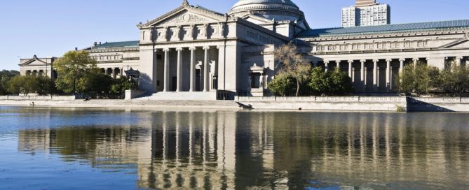 The Ohio Statehouse In Columbus, Ohio, With Its Classical Architecture Reflected In The Water, Under.