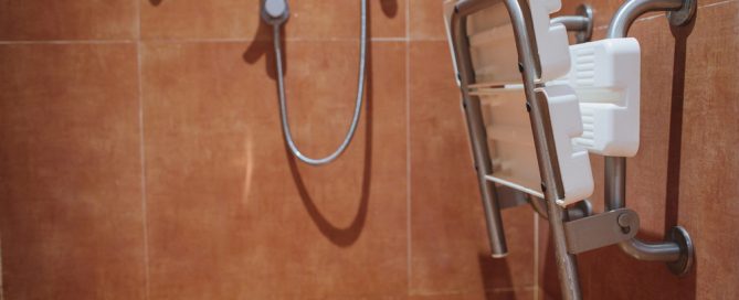 Shower Chair With Safety Features In A Bathroom For Elderly Safety.