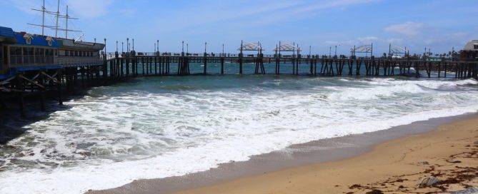 Waves Rolling Onto The Sand Beside The Wooden Pier, A Starting Point For Stroller Walks Near Redondo Beach Pier